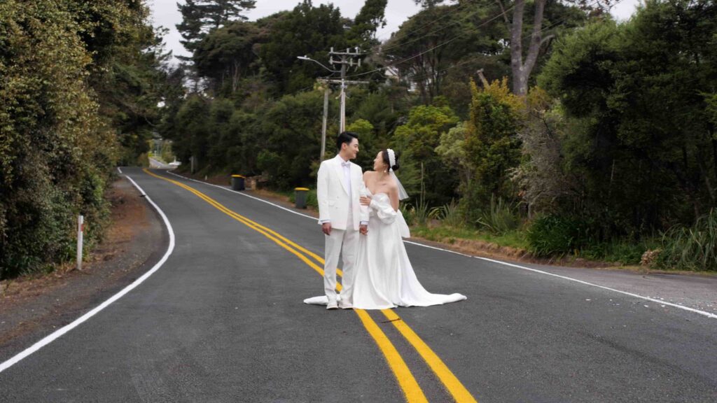 Wedding Couple standing down road
